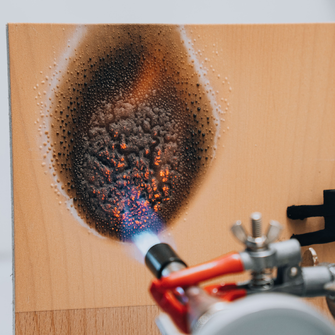 In the case of a fire, the coating forms a foam which creates an insulating barrier over the wood. | © ADLER