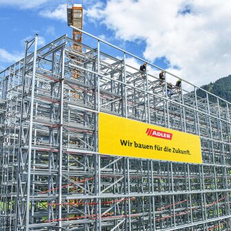 The first of the almost 30-metre high rows of racks are already towering into the sky above Schwaz.